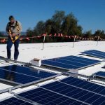 Attaching Solar Panels on School Solar Project on Rooftop MM Electrics Biloela Banana Shire Solar
